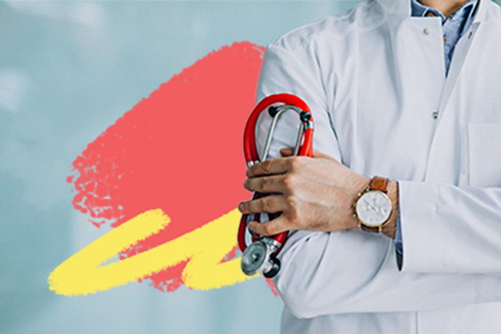 Doctor holding a stethoscope with their hand.